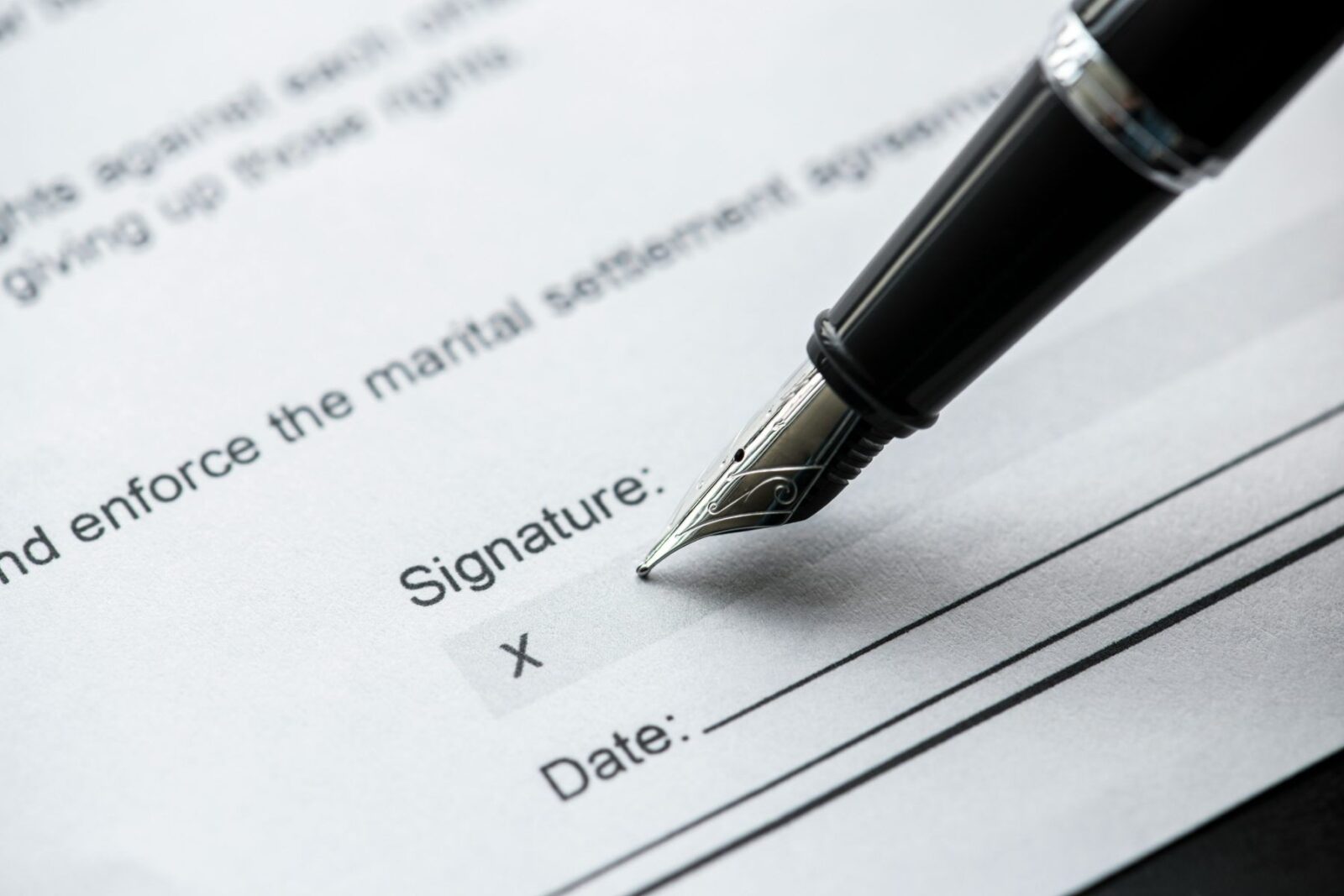 A fountain pen signing an agreement, such as convertible loan notes