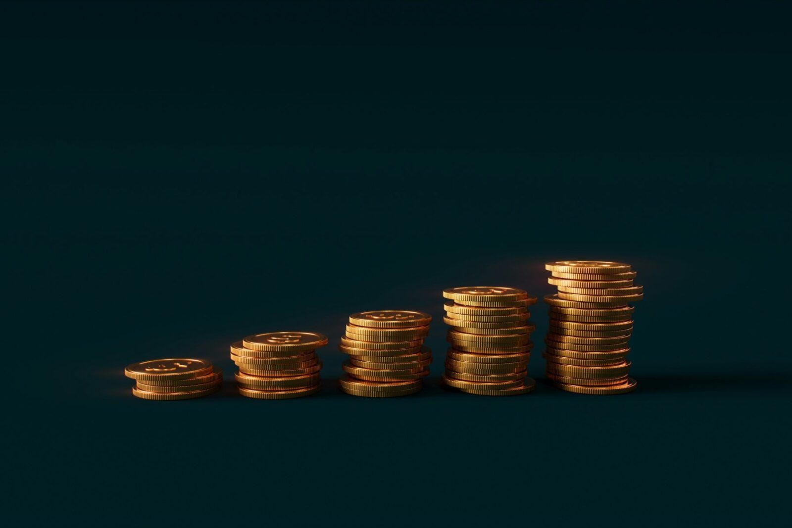 Stacks of coins rising in height, like income from dividend investing