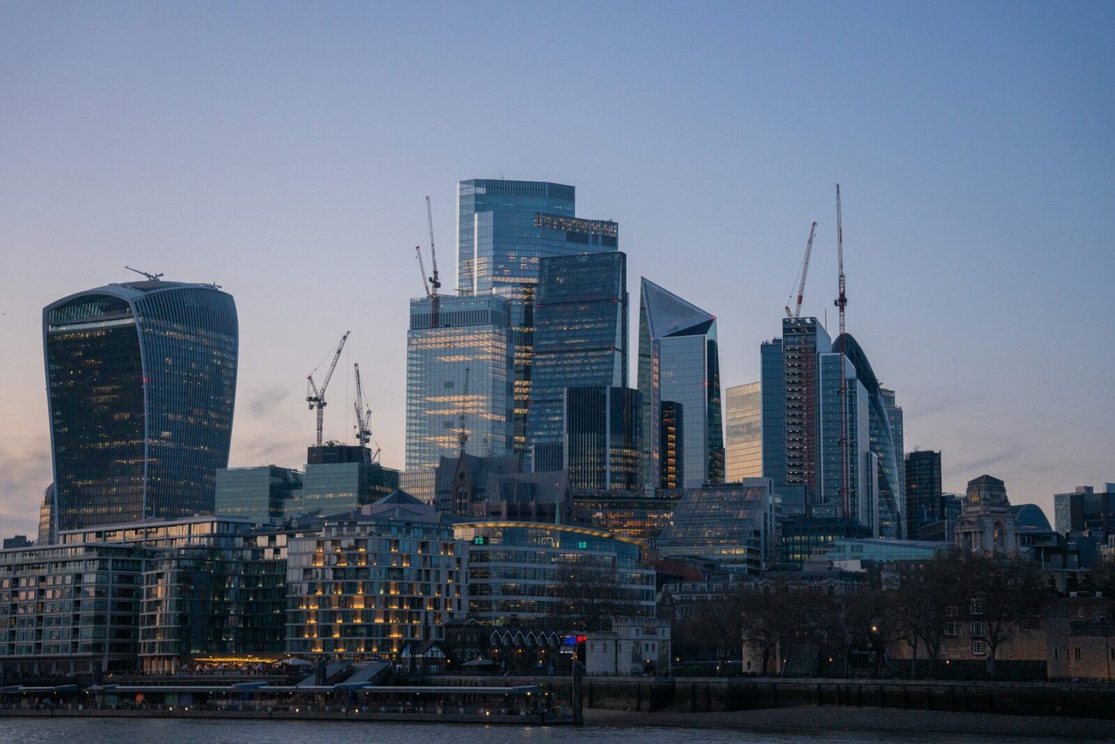 Office towers in the City of London at dusk, the kind of property illiquid funds own