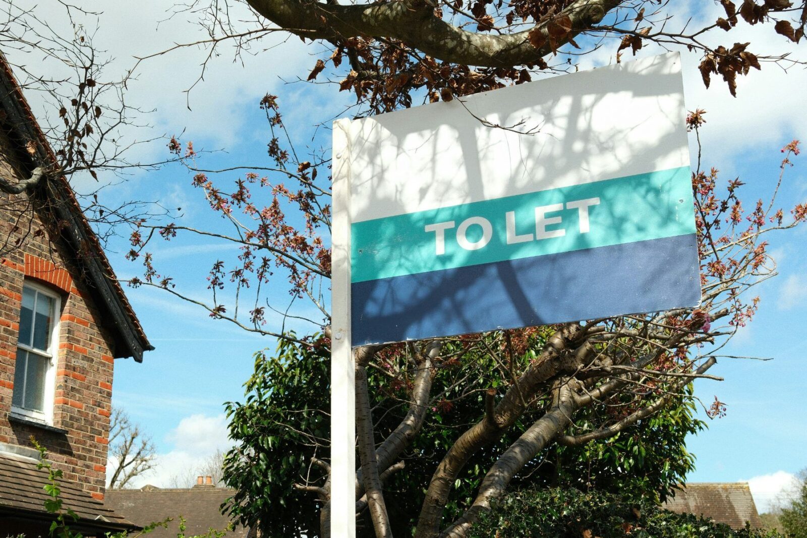 A to let sign outside a brick house; landlord tax rises in 2027