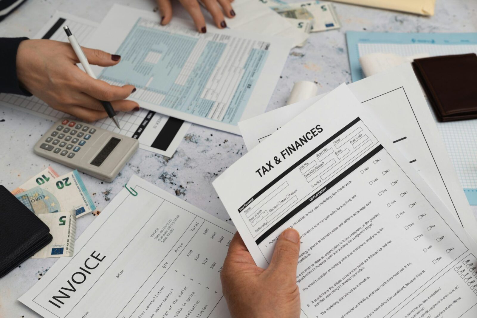 A person filling in forms, planning tax efficient investing